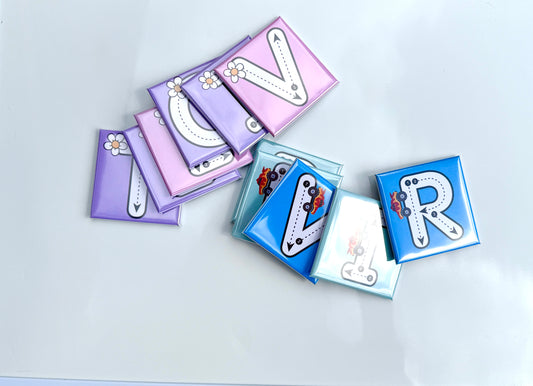 Decorative letter 'V' and 'R' magnets on a light gray background